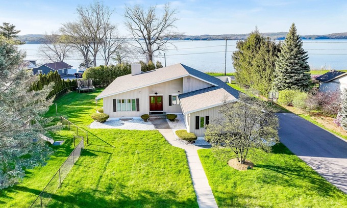 Colchester House | Lakefront home with pool, beach access, central AC, washer/dryer, & fireplace