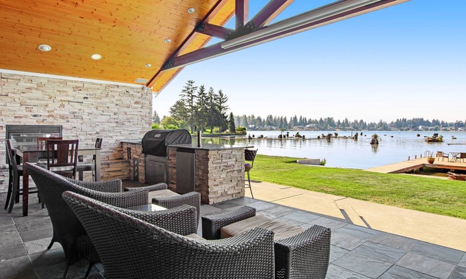 Bonney Lake House | Lakefront house with built-in bar & grill, fireplace, beach, & dock
