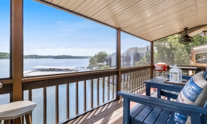 Lake Ozark Condo | Lakefront top-floor condo with grill, screened-in balcony, pool, fireplace, W/D