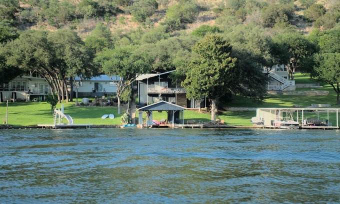 Sunrise Beach Village House | Lakefront retreat on quiet cove with large deck and sweeping views.