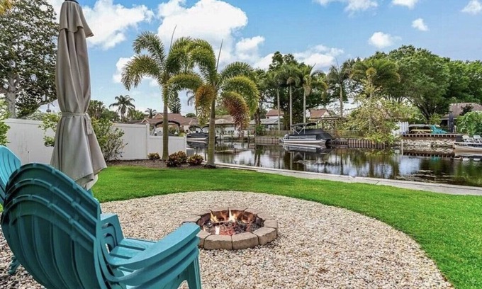 Palm Harbor House | Lakehouse Living w/Firepit and Boat Dock to relax and Enjoy the Sunset