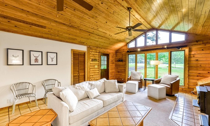 Blue Water House | Lakeside log home with a private deck, WiFi, firepit, central AC, & washer/dryer