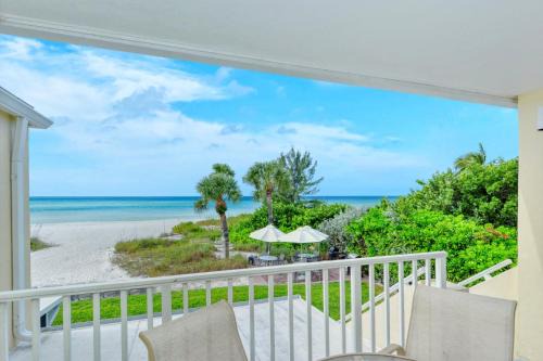 Longboat Key Apartment | LaPlaya 201C Breathtaking Gulf panorama from this corner end unit with a private stairway to the beach