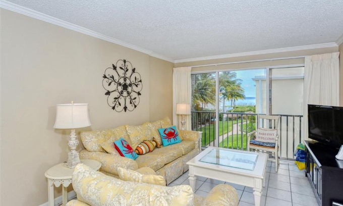 Longboat Key Apartment | LaPlaya 201E Nestled in the palms just steps from the pool