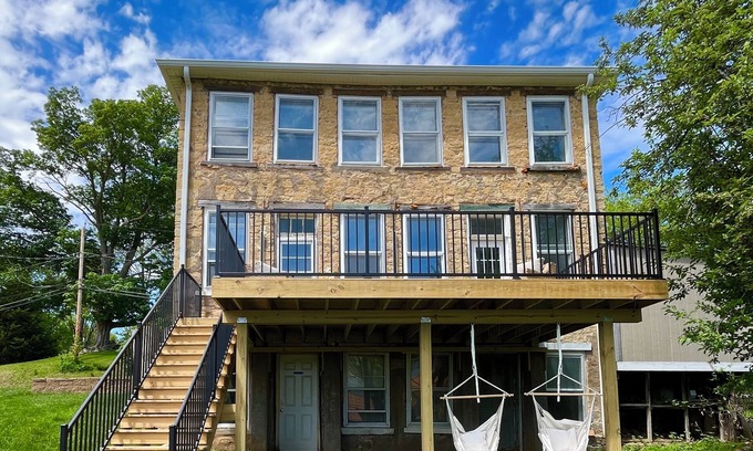 Le Claire House | LeClaire historic stone house with modern updates, river views and large yard
