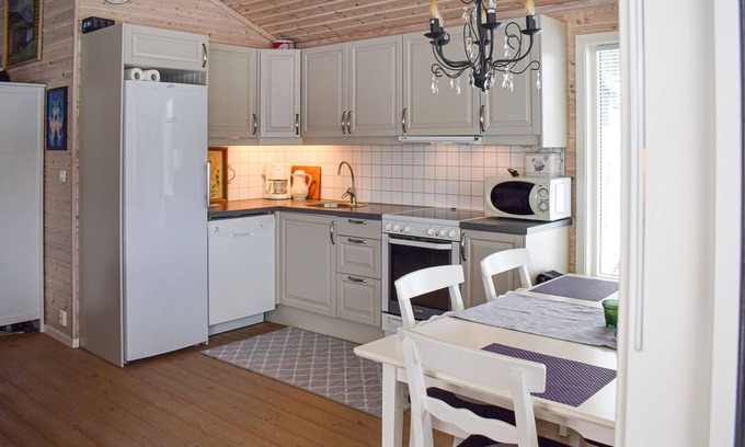 Nissedal House | Light-flooded vacation home with spacious conservatory and great views of Lake Niss.