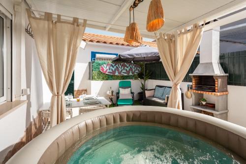 Costa de Caparica Apartment | "Linda's Guest House" Beach House with Private Patio & Hot Tub, 3 Min from the Beach