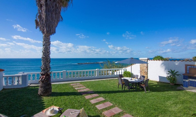 Los Canos de Meca Villa | Los Canos De Meca: Wonderful Villa located in front line beach, over a small cliff. Private garden and terrace with magnificent sea views. There is a private access to the beach below.