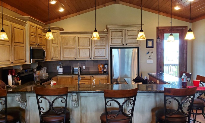 Hackberry House | Lovely 4-bedroom elevated house with Front and Back Porches, on a canal