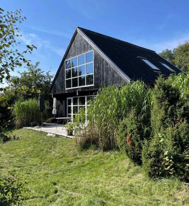 Øer Strand House | Lovely Beach Home Enveloped In Green Surroundings