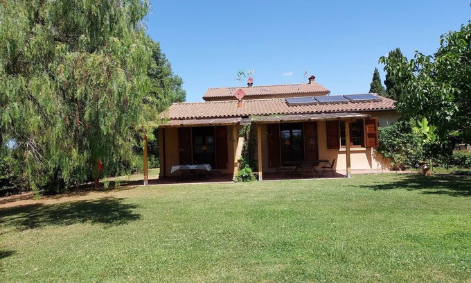 Rosignano Marittimo Apartment | Lovely flat with private covered terrace, pool, large shared garden.
