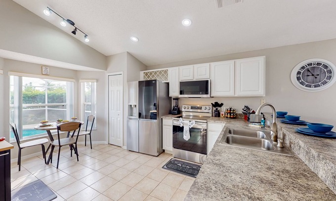 Westbury House | Lovely home with a heated pool, open-concept interior, central AC, and W/D