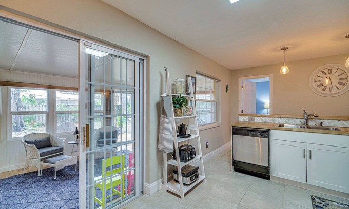Surfside Estates Cottage | Lovely Merritt Island Home w/Kayak + Fire Pit!