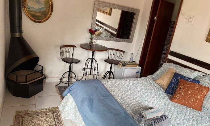 Quatis House | Lovely place, suite with fireplace.