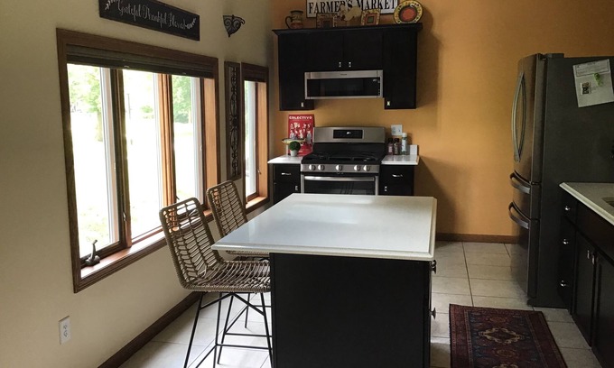 Mishicot Apartment | Lovely riverfront destination featuring open concept loft style. Water view.