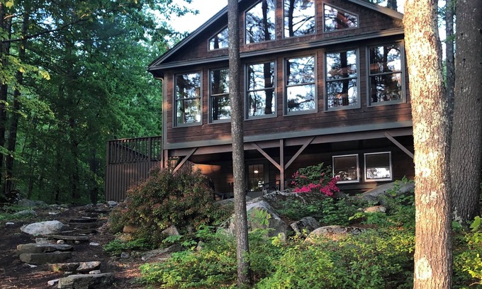 Raymond House | Lovely waterfront home on Panther Pond with private tennis/pickleball court!