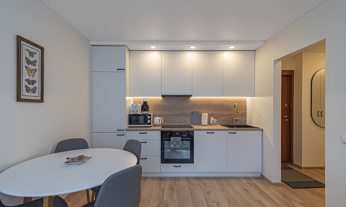 Kaunas Apartment | Luminious apartment with balcony by Polo Apartments