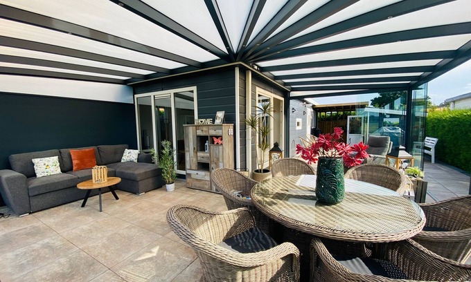 Lathum Ski Chalet | LuxChalet vacation home ELLA view on Ijssel in vacation park Pool Strand Holland