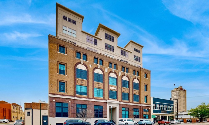 Brazos Condo | Luxe downtown loft in historical building with Peloton & lanai - highly walkable