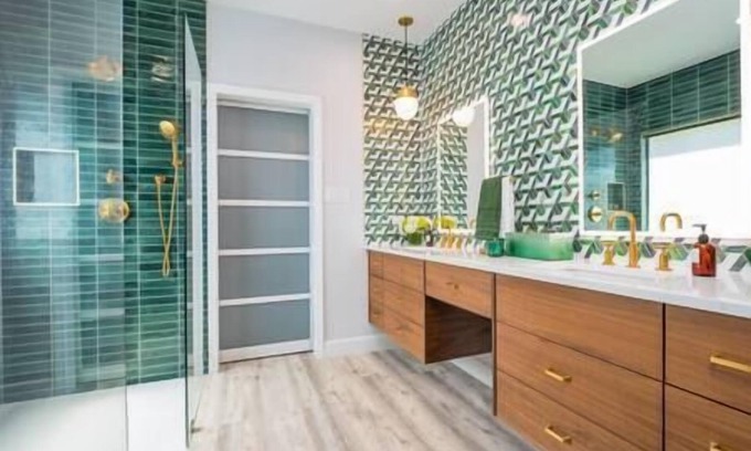 Wetmore House | Luxe Home-Designer BTHRM-Covered Deck-Weber Grill