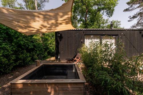 Nunspeet House | Luxe Hottub Japandi Tiny house in het Bos
