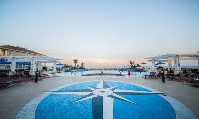 Red Fish Cove Condo | Luxurious beachside condo- steps to beach club