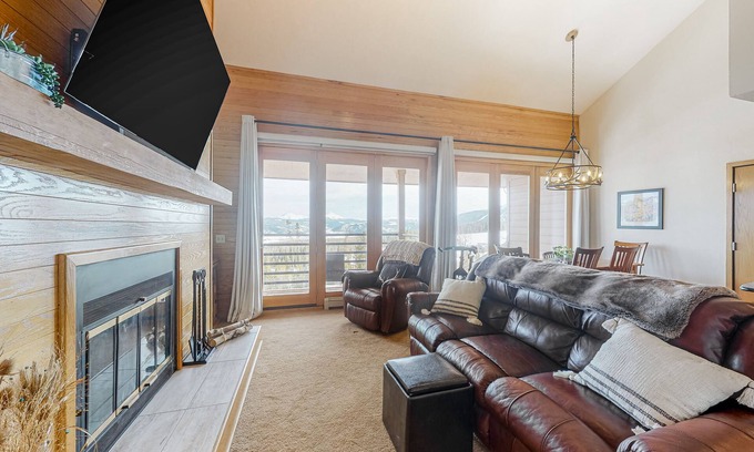 Wildernest Condo | Luxurious top-floor condo with balcony, WiFi, fireplace, great views, & location