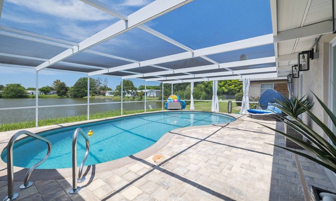 Regency Park House | Luxury 3BR Home w/Heated Pool, Outdoor TV, Bikes & BBQ – Perfect for Families with Modern Kitchen!