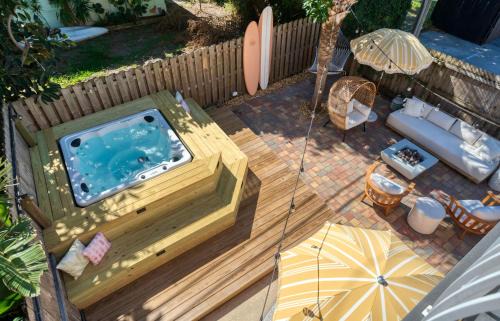 Port Canaveral Villa | Luxury Beach House 3 Blocks from the Beach with Hot Tub a Fire Pit Outdoor Oasis