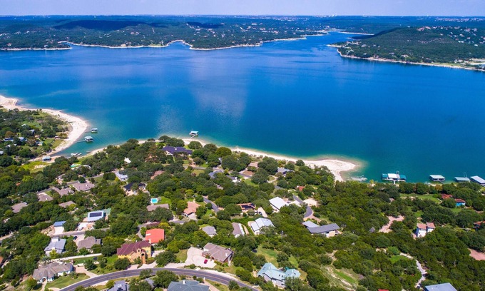 Comanche Trail House | Luxury home with private boat dock, huge yard by the water, Sand Volleyball, Hot Tub, Lake views!
