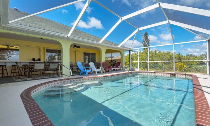 South Gulf Cove House | LUXURY WATERFRONT! WARM PRIVATE POOL! MIN TO BEACHES! WIFI! GRILL! BABY SUPPLIES