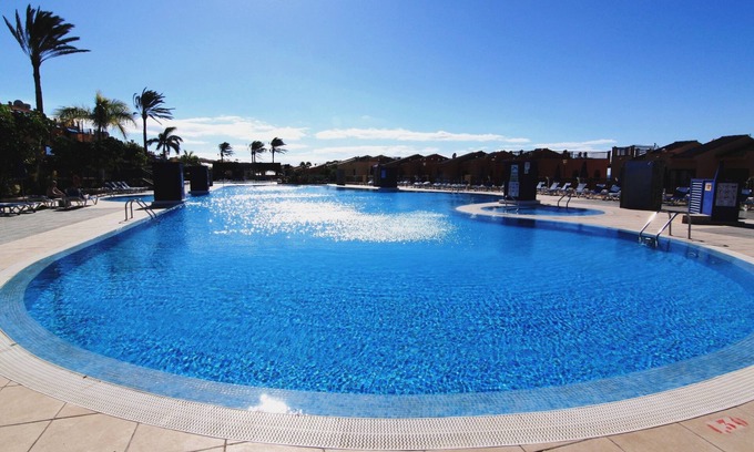 Costa Meloneras House | Magnificent Bungalow with sea and Golf views and large garden and solarium