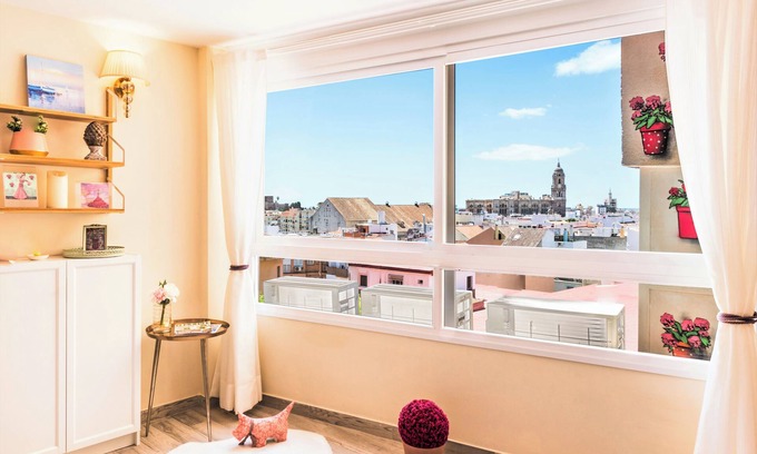 El Ejido Apartment | Malaga Centro. Free private parking. Cathedral views. Air conditioned.