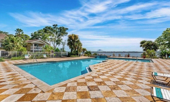 Merritt Island Apartment | Merritt Island Sunset ~ Riverside Pool & Hot Tub