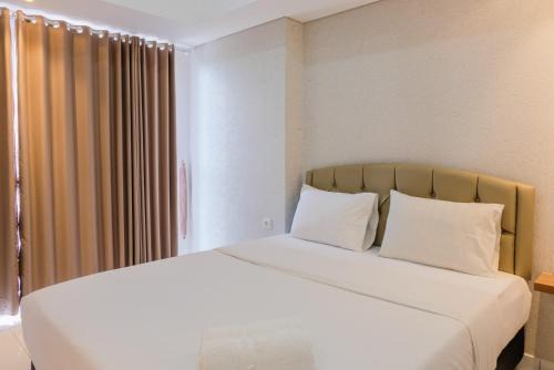 Bumi Serpong Damai Apartment | Minimalist Studio Apartment at Casa De Parco By Travelio