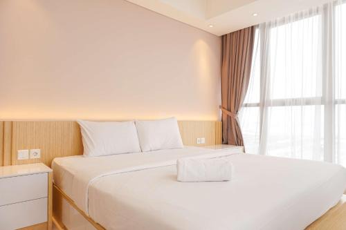Pantai Indah Kapuk Apartment | Modern Look and Nice 2BR Gold Coast Apartment near PIK By Travelio
