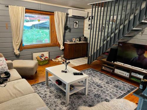 Etelainen House | Mökkituulos, beds for 4 One big bedroom, two beds separated with a big wardrobe