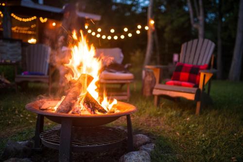 Melsungen House | Naturhäuschen mit Kamin - Feuerschale - Garten - mit beheizbarem Gartenwhirlpool