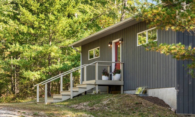 Big Rapids House | Nestled in the woods, this private detached Guest House is a perfect getaway!