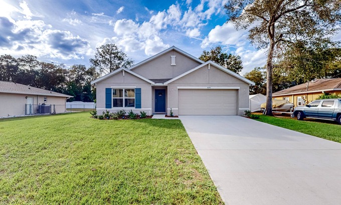 Spring Hill House | New home with large yard, covered patio, grill, central AC, & W/D