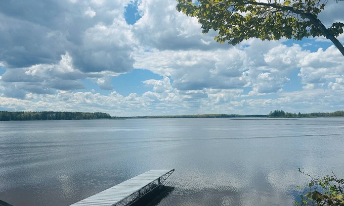 Alpena House | NEW LISTING! Spacious 4-bedrooms lake front retreat in delightful Alpena area.