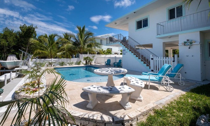 White Marlin Beach House | New saltwater pool, pet friendly, waterfront house with dock