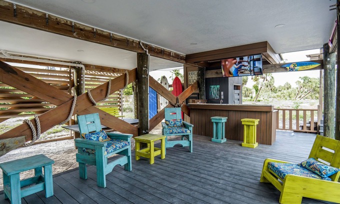Palm Island House | Newly Remodeled & Upgraded Home w Deck, Bar, PingPong Area Volleyball Sand Court