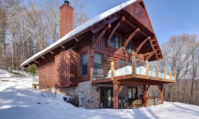Lac Superieur Village Ski Chalet | Newly renovated log home with private spa and lake access.