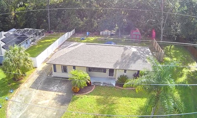 Summerfield House | Nice 2/2 house just 3 blocks from The Villages! Serene privacy with forest view!