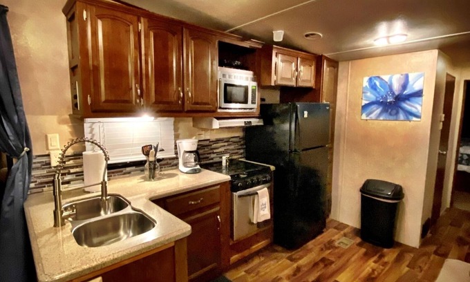 Milton RV Rental | Nice 40’ RV with all modern conveniences, (full kitchen, bathroom, separate bedroom), in private Resort/campground, pool, hot tub, sauna, clubhouse available to all guests.