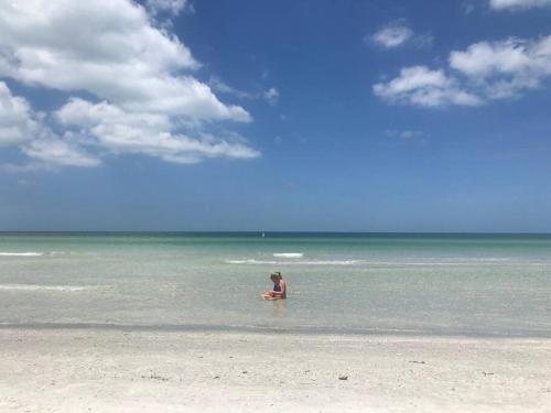 St. Pete Beach Apartment | Ocean view balcony with heated pool