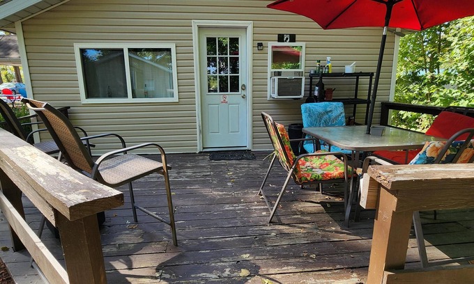 Monticello Cabin | One Bedroom Cabin - Lakeview - Charming 500 sq ft one-bedroom cabin located at Outrigger Resort, just 1/4 mile from Indiana Beach Amustment Park! Features a lake view, private bathroom, kitchen, and living room. One (1) queen bed and one (1) futon al