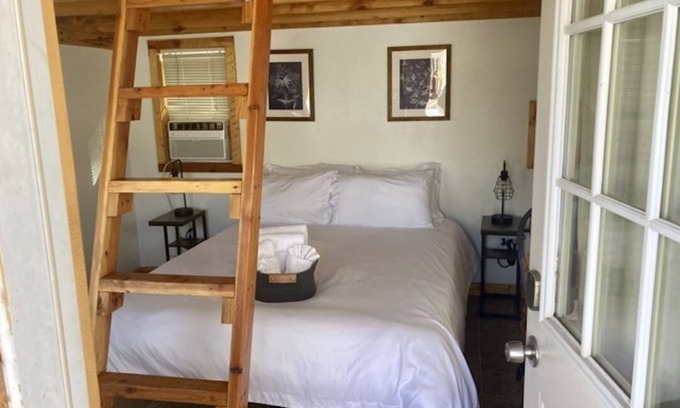 Montrose Cabin | One room camping cabin Double bed on the main level and two lofted twin-size beds Heating and cooling Sleeps: 4 Pets: 2 Parking: 1
