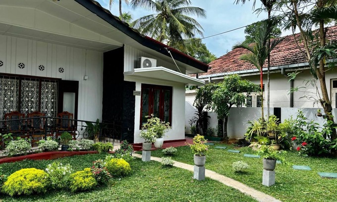Kochchikade Apartment | Palmwood Cottages Double Bed Room with Kitchen